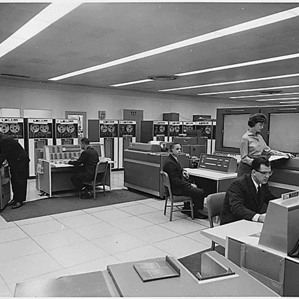 An early computer room with rows of machines