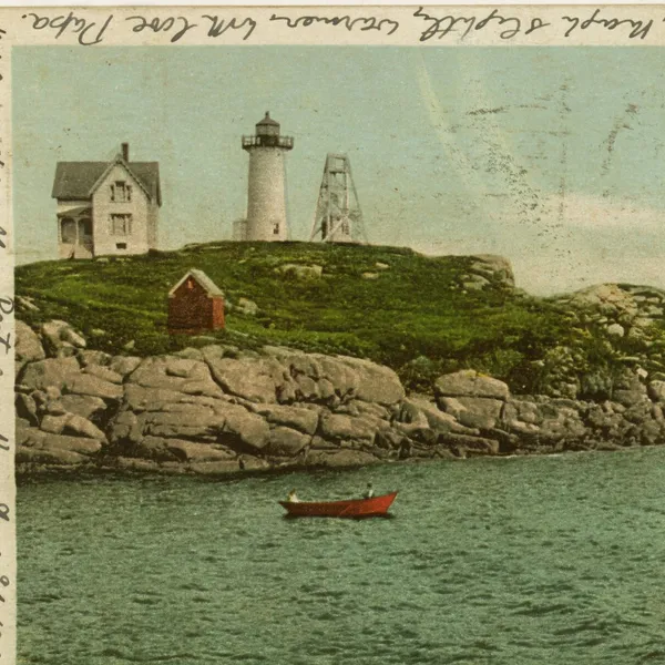 An old postcard of a lighthouse on a small island